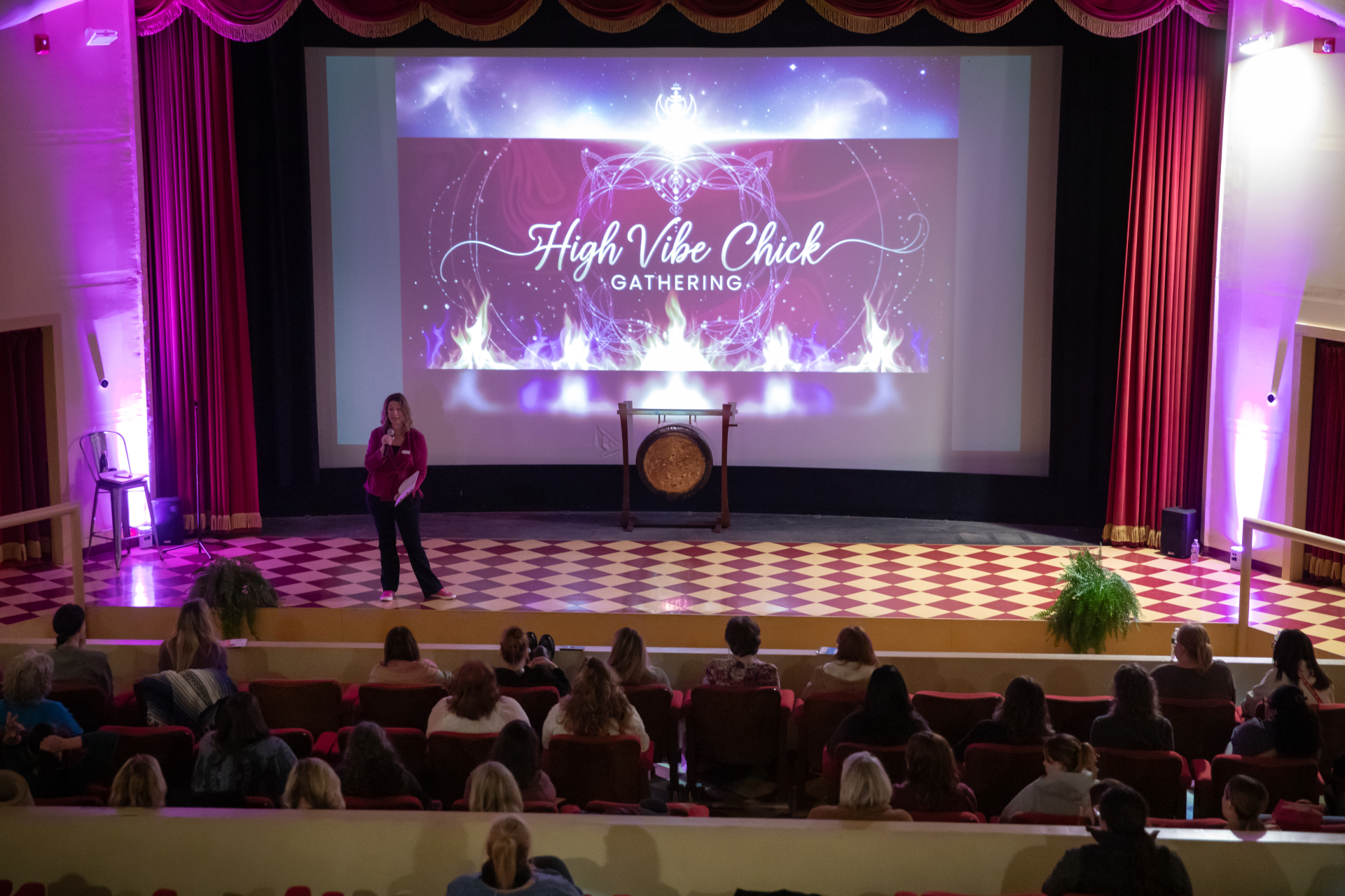 Stephanie opening the High Vibe Chick Gathering on stage at the Colonial Theatre